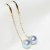 Paio di Orecchini perle Akoya blu 7-7,5 mm AAA su traversine in oro 18k