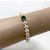 Braccialetto perle d'acqua dolce bianche 7-8 mm AAA, una perla peridoto verde, 2 perline d'oro 14k