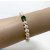 Braccialetto perle d'acqua dolce bianche 7-8 mm AAA, una perla peridoto verde, 2 perline d'oro 14k